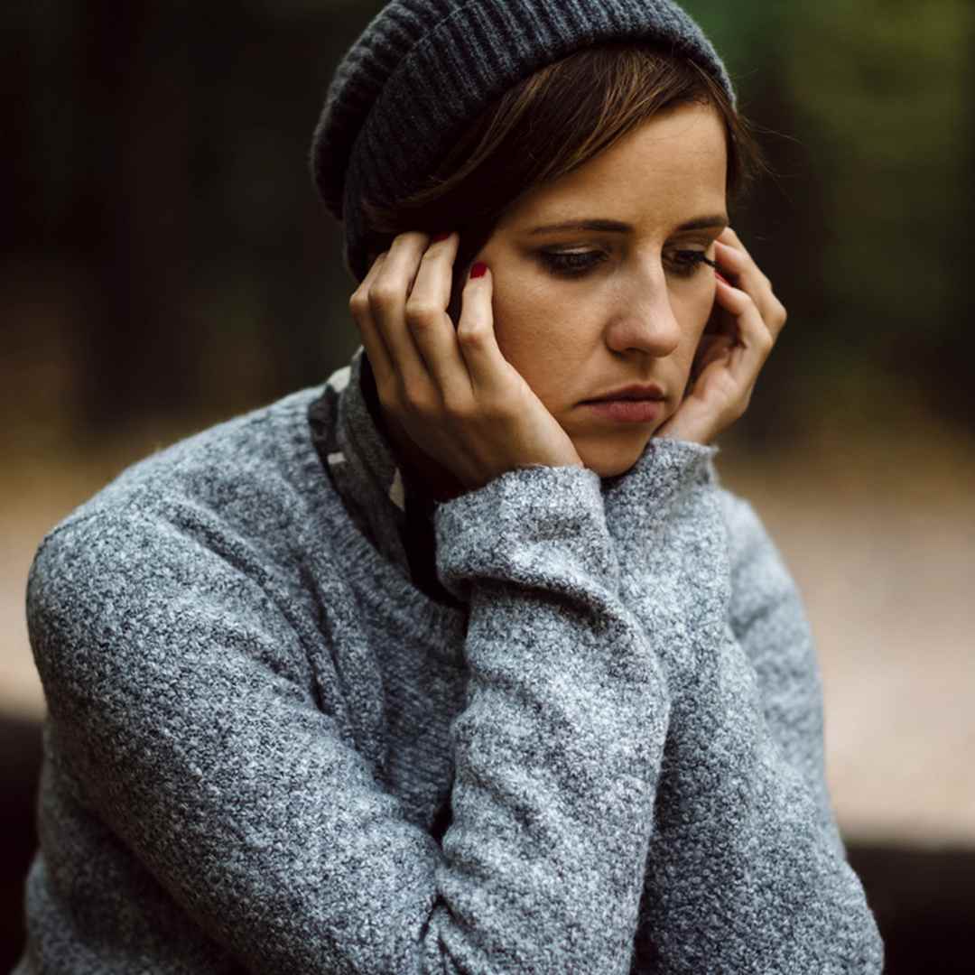 Image of a young woman looking depressed