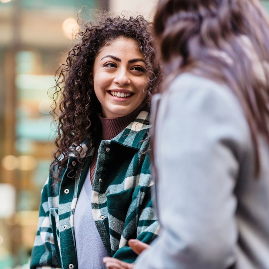 two woman talking together